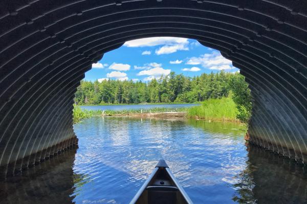 Canoeing through culvert into Follensby Clear Pond
