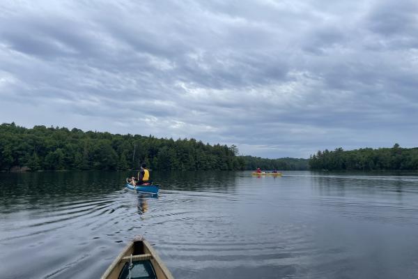 Group of canoes paddling on Long Pond