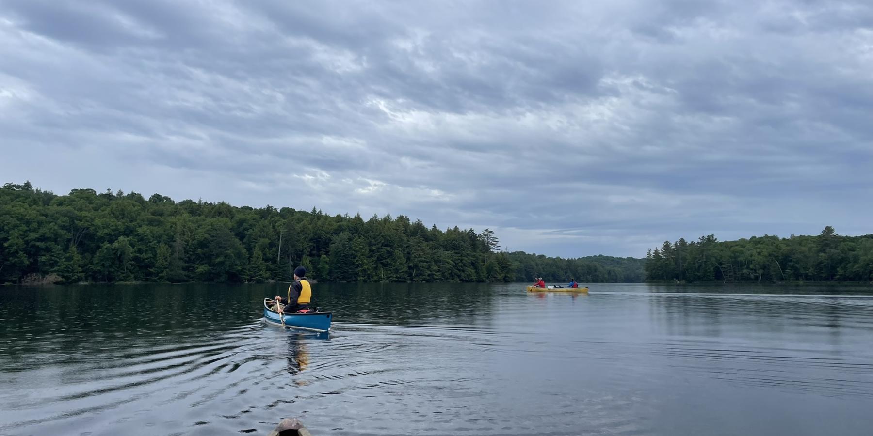 Group of canoes paddling on Long Pond